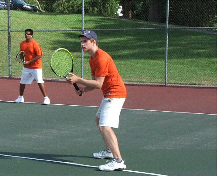 Sophomores Keeshev Seetharaman and Trevor Macks prepare to return a serve during doubles practice. The two helped lead the young team to the regionals and an impressive record in the MAC Blue as doubles partners. “The two of them were impressive,” Farr said. “They can improve even more next year.”  