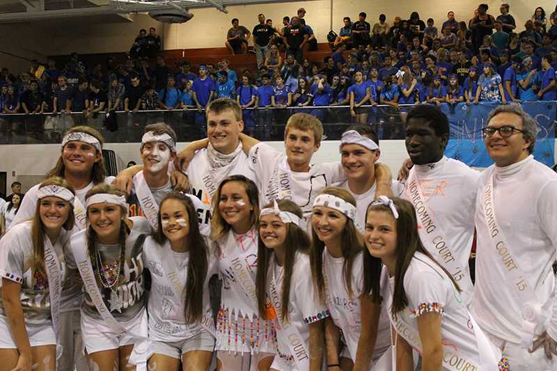 The 2015 homecoming court poses for a picture after they are announced at the competition assembly.