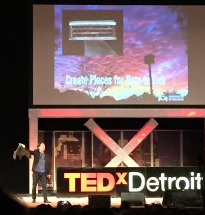 Rob Mies of the Organization for Bat Conservation shows the audience the worlds largest bat at TEDx Detroit.