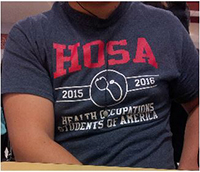 This is the Design of the Utica 2015-16 HOSA shirts, 
being worn by Senior Marshal Tan.