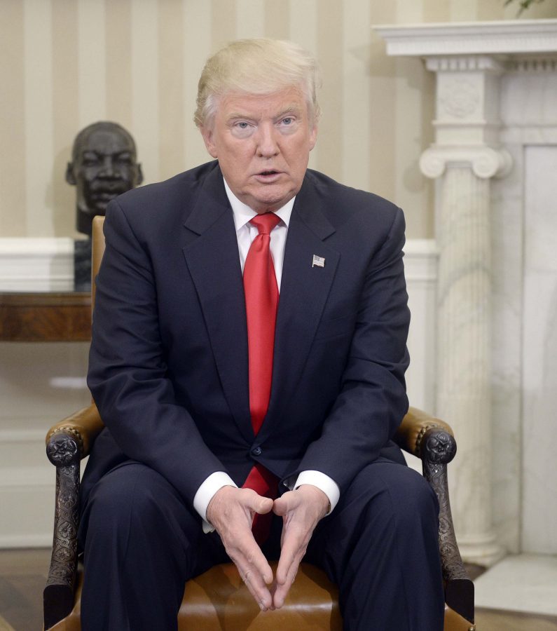 President-elect Donald Trump looks on in the Oval Office of the White House on Thursday, Nov. 10, 2016 during a meeting with U.S. President Barack Obama in their first public step toward a transition of power in Washington, D.C. (Olivier Douliery/Abaca Press/TNS)