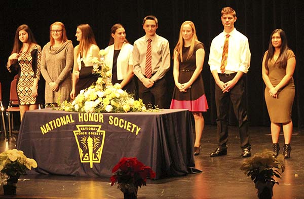 National Honor Society executive board members prepare to welcome new members at the induction ceremony Dec. 8.