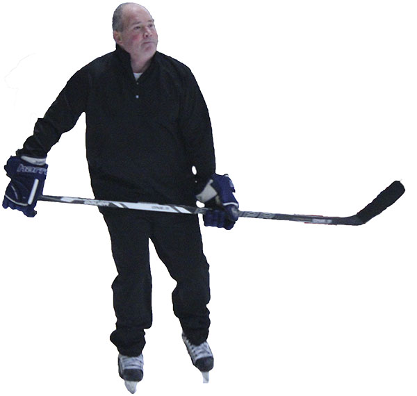 Coach Robert Clouston skates with his team at practice.