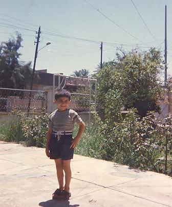 In 1998, five-year-old Aws Polina stands in the backyard of his home in Iraq.