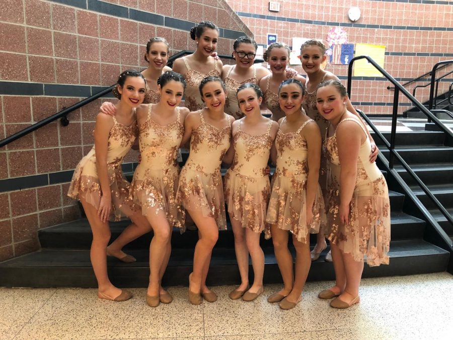 The+varsity+dance+team+poses+before+performing+their+jazz+dance.
