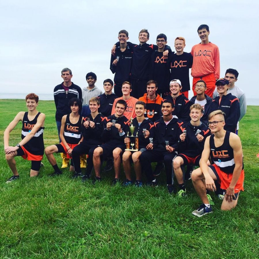 The boys cross country team poses after a meet.