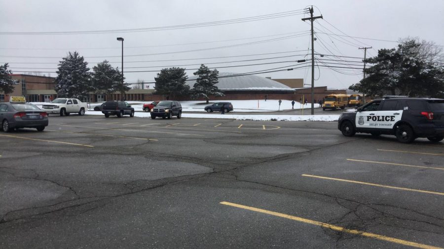 As students exit school on Wednesday, March 7, officers from the Shelby Township Police Department were parked at various locations around the school.  The extra precaution, was taken after a senior was arrested and charged with making a terrorist threat or a false report of terrorism on Monday.