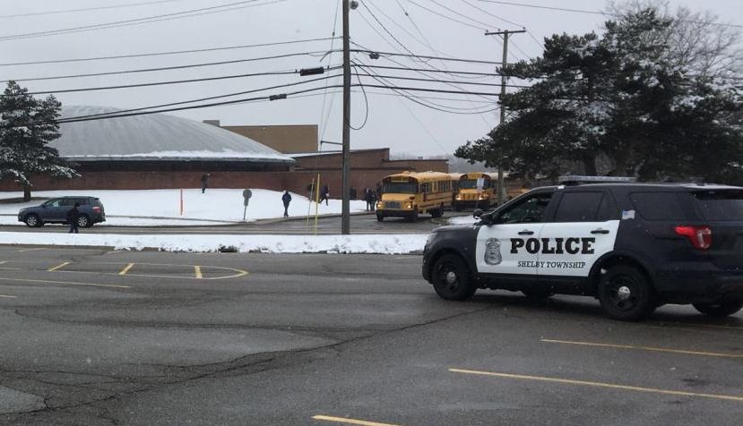 As students exit school on Wednesday, March 7, officers from the Shelby Township Police Department were parked at various locations around the school. The extra precaution, was taken after a senior was arrested and charged with making a terrorist threat or a false report of terrorism on Monday.