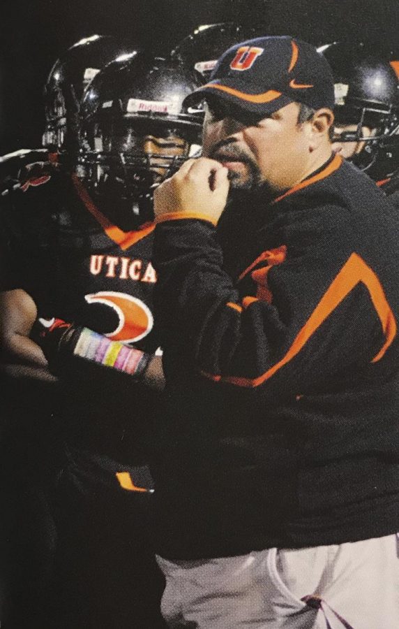 During a timeout, Glenn Doss gets a pep talk from football coach Tony Smith. “He was a very good football player,” Smith said. “He played all three of his high school years on varsity.”