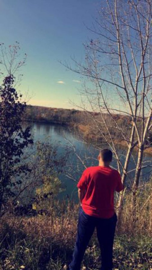 Junior Joe Dushi watches over the pond