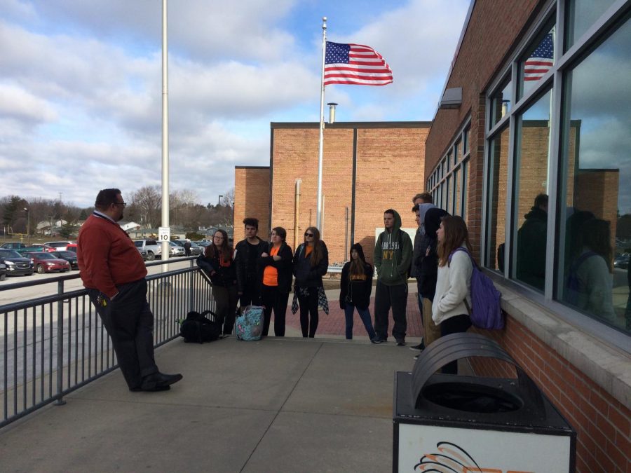 Principal Tom Lietz speaks with a group of students that participated in the National School Walkout on March 14.