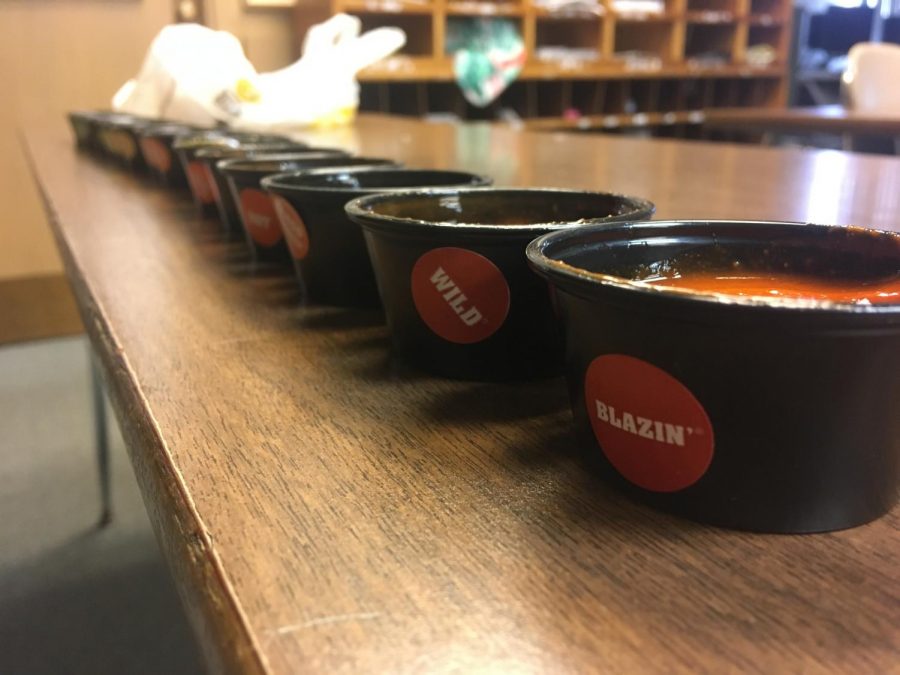 All the spicy sauces are lined up for a taste test. The crew will be picking their favorite.