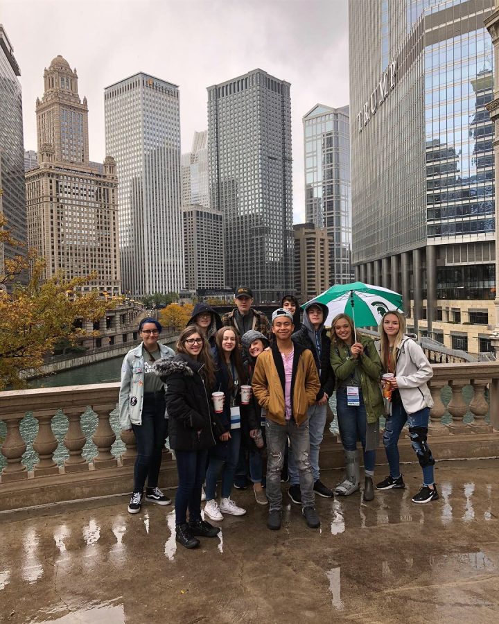 205 crew takes a picture in front of the Chicago skyline.