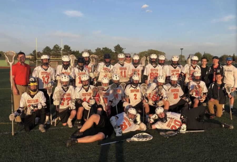 The+lacrosse+team+celebrating+their+first+ever+playoff+win+GAVIN+FROMM+COURTESY+PHOTO