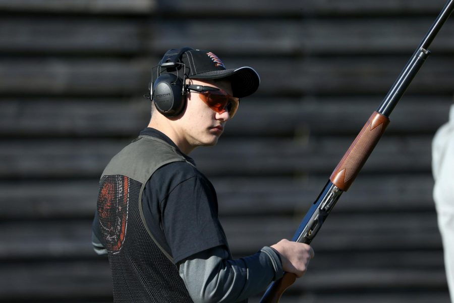 With his gun loaded, sophomore Nathan Bazzo is ready to call “Pull” so his target can be launched into the air. “I decided to try something new,” Bazzo said. “I like shooting, so I thought the clay target team would be a fun thing to do.” 