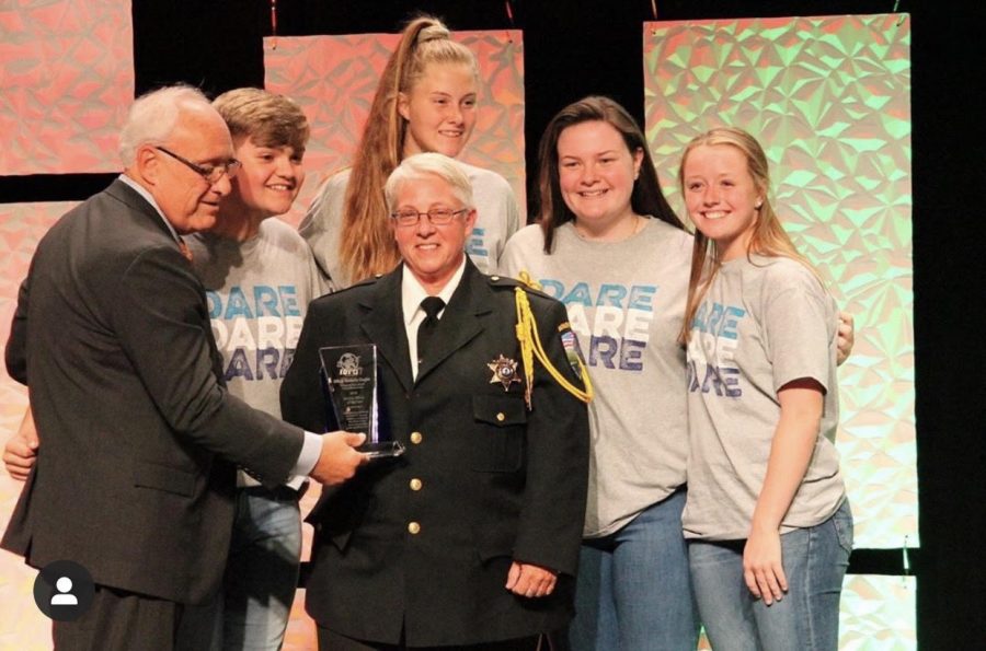 Jack Droelle (Left) at a D.A.R.E Award with the Officer of the year
@midareyab