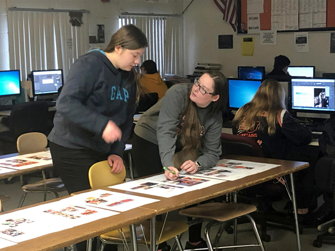 In the news room at Utica High, editors Cassidy Eskew and Lauren Kerr edit yearbook proofs before they are sent out for publication in the yearbook.