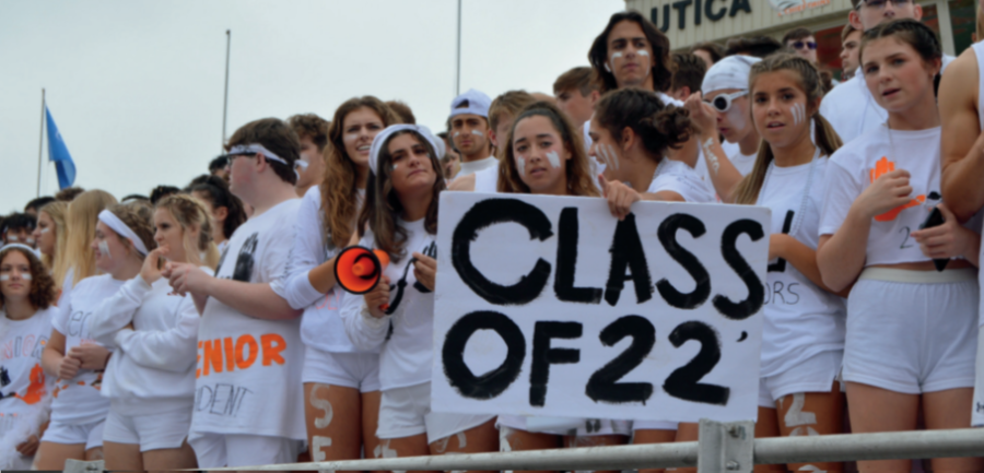 Seniors show off their class colors at the pep rally with student Alyssia Johnson holding a Class of 22 sign. Photo by Natalie Garwood