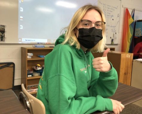 Junior Sophia LaBrecque wears her mask correctly while waiting for class to start.
