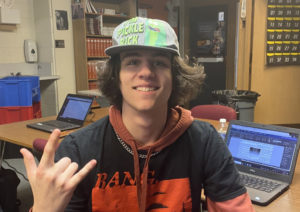 Senior John Adkins often wears a hat to school, only to be told to take it off when he arrives.