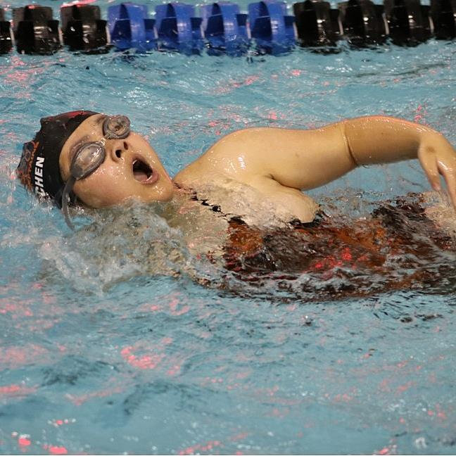 In the team pool  at Eisenhower High School, sophomore Niki Chen takes a breath in between strokes.