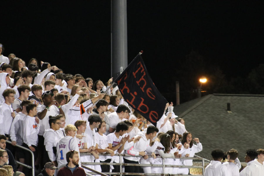 The+Tribe+student+section+cheers+for+the+varsity+football+team+after+a+touchdown.