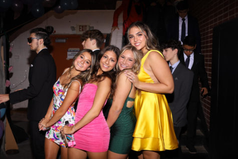 pic by Natalie Garwood Sophomores Lila Nassri, Riley Coughlin, Sophia Jirjis, and Isabella Weihermuller are posing together on the night of the dance.