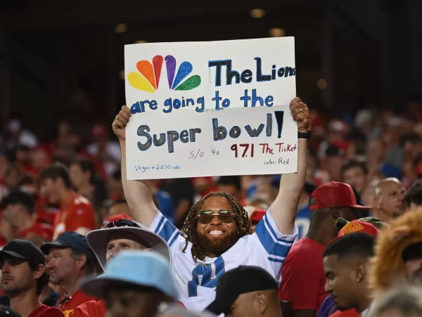 Lions fan holding up their creative sign.