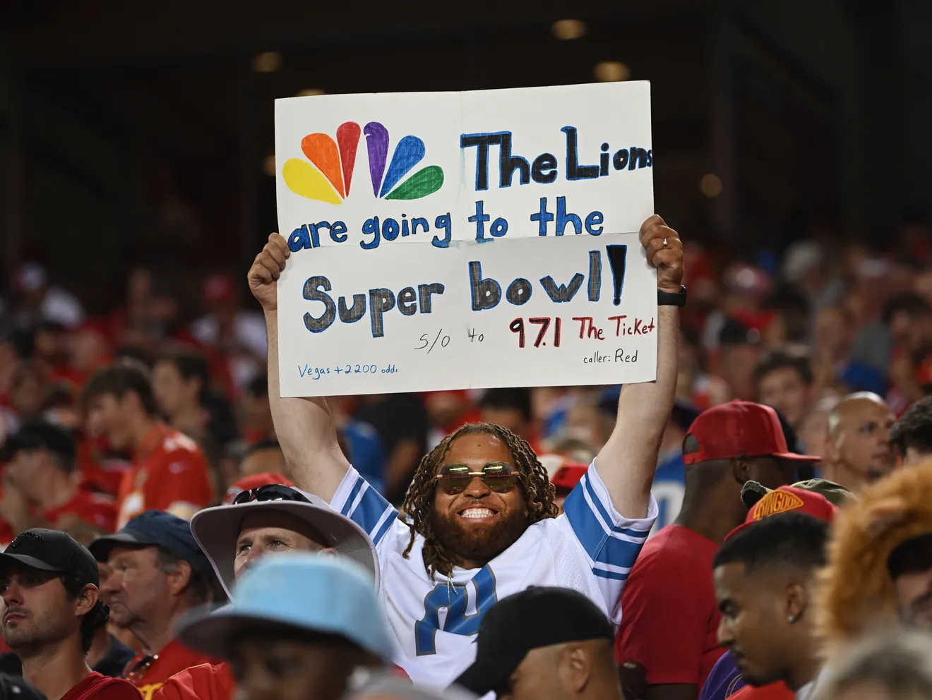 Lions fan holding up their creative sign.