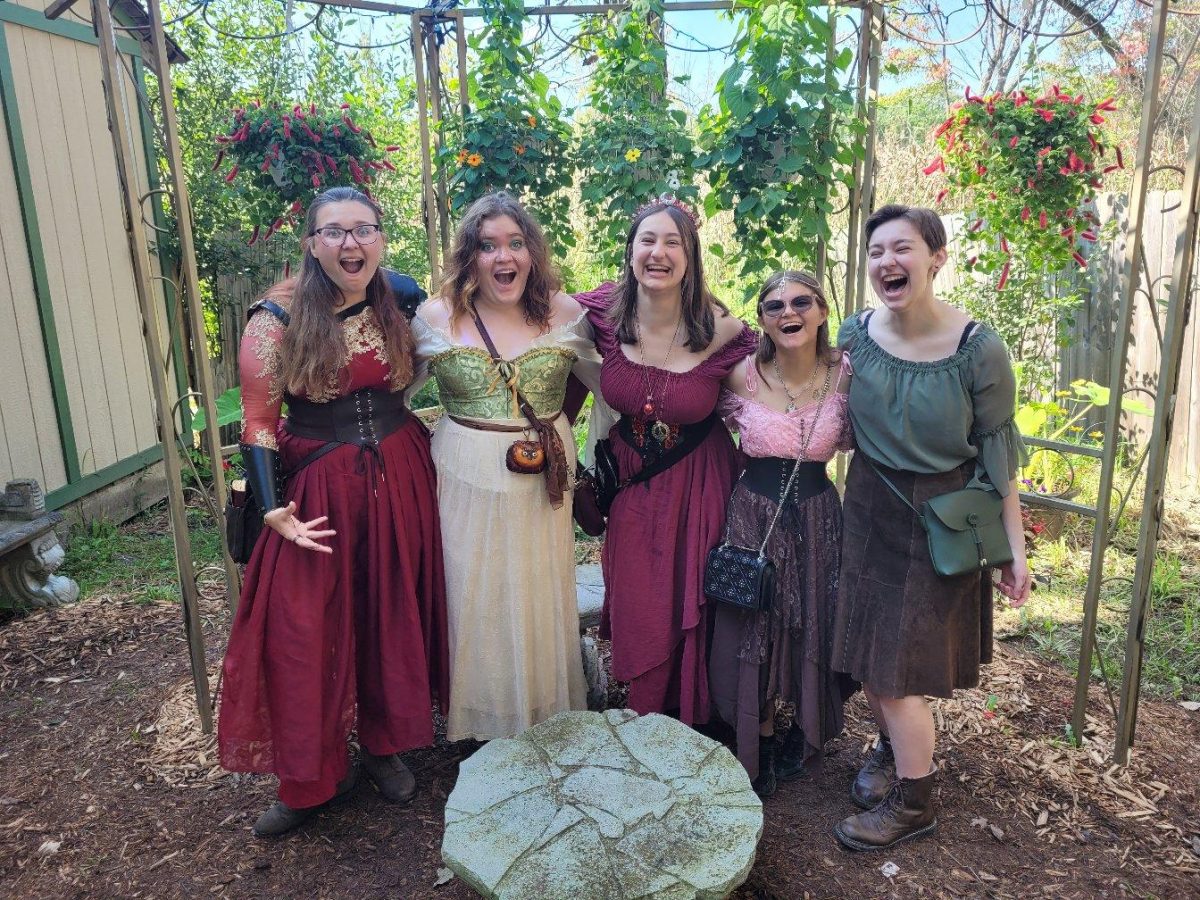 Senior Maia Suggs, senior Kenadi Hazen. senior Lauren Garwood, junior Jaelyn Kaczmarczyk, and senior Natalie Garwood wore costumes to Michigan’s annual Renaissance Festival. photo by Natalie Garwood