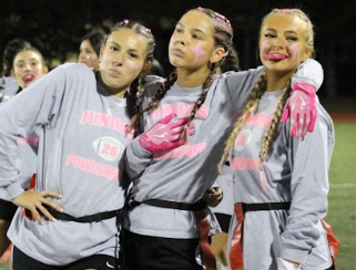  juniors Isabella Blanchett, Kylie Newcomb, and Brooke Stalker pose after their glorious win underneath the Swinehart lights.