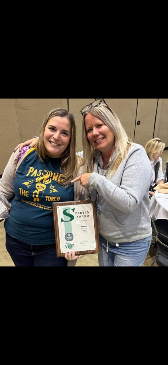 Teacher Suzanne Greenfield and former teacher Stacy Smale with the 2023-2024 awards for Utica High School's yearbook and newspaper.