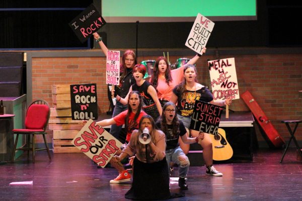 The ensemble, dressed as protestors, sing “We’re Not Gonna Take It” as they defend the Sunset Strip with junior Nikolina Anceski in the lead.