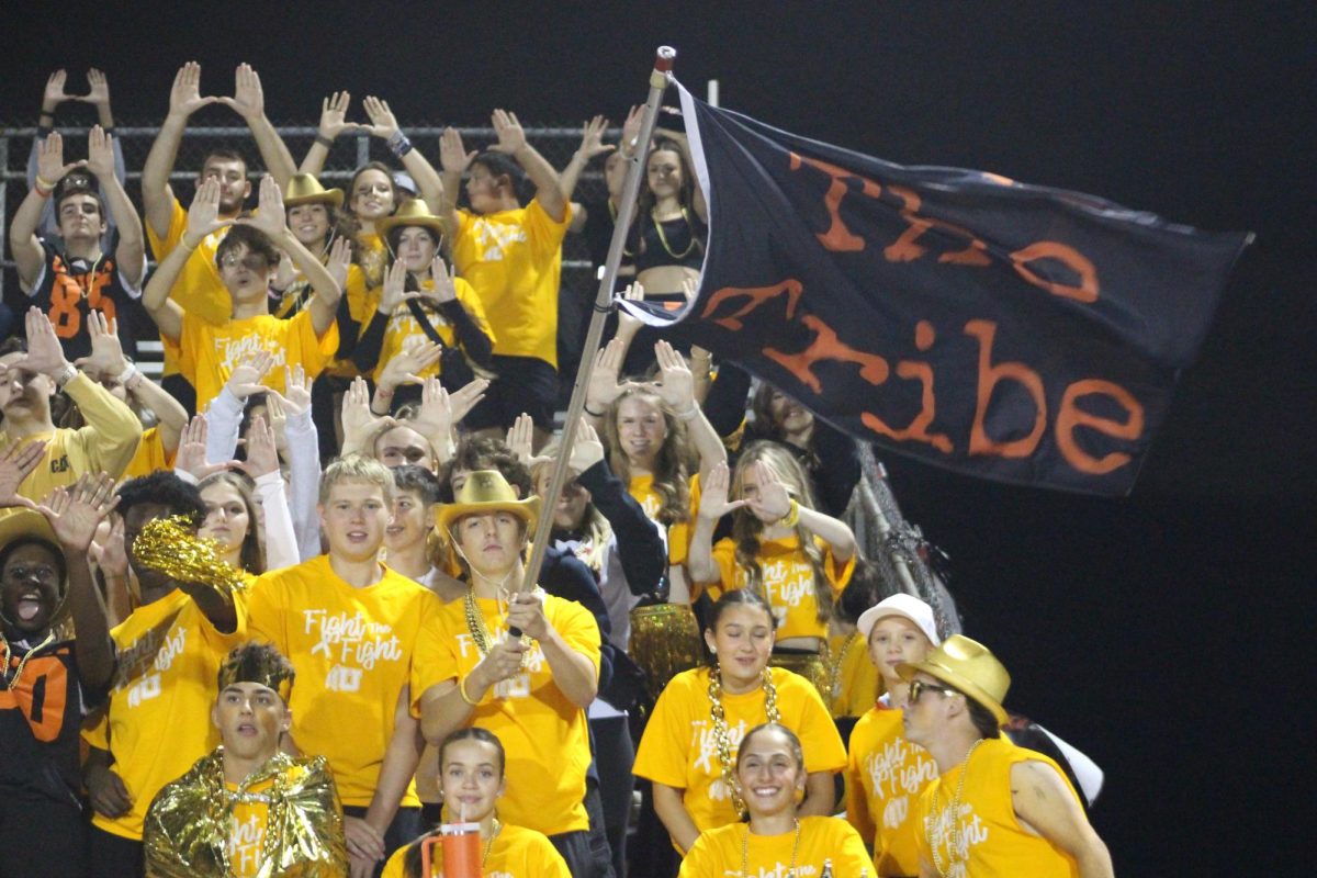 The Utica Tribe goes wild at the Gold Out football game against L’Anse Creuse High School.