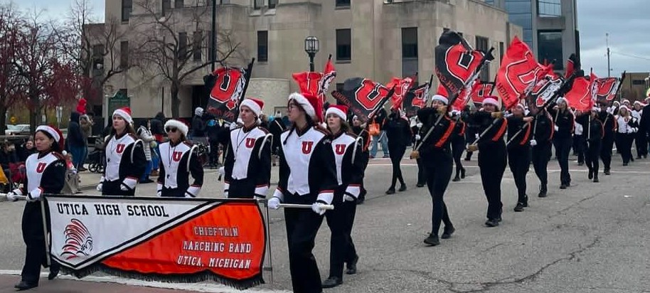 Utica High School band marching in their final parade of the season. 