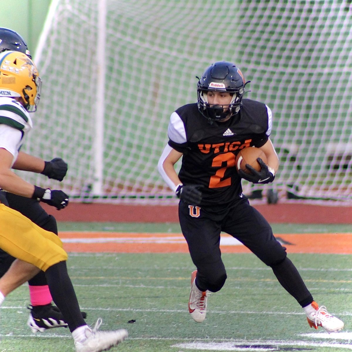 Photo of the Day #37!
Freshman Dominic Asaro trying to avoid his opponent
Grosse Pointe North, from last nights game.