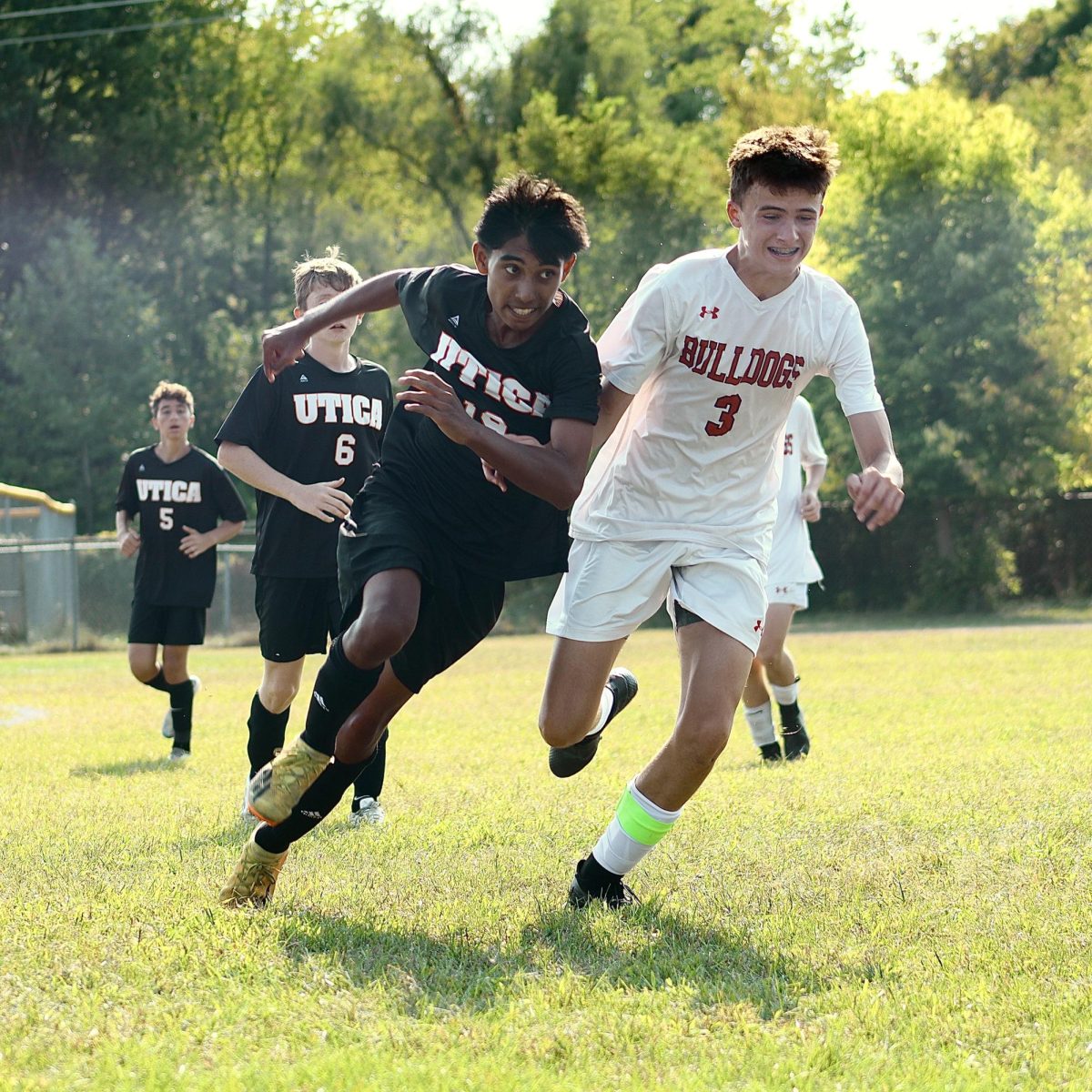 Photo of the Day #5!
Sophomore Shuhan Khan chasing down the ball in hopes to reach it before his opponent.