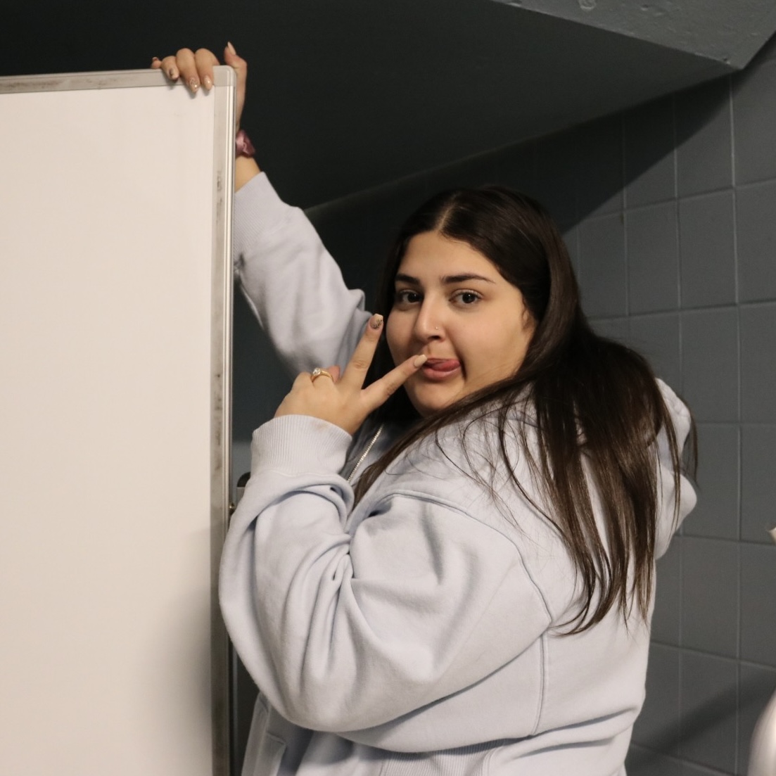 Photo of the Day #56!
Senior Zoee Faranso having a little fun while helping Mrs. Woodall, by pushing whiteboards down the hallway.