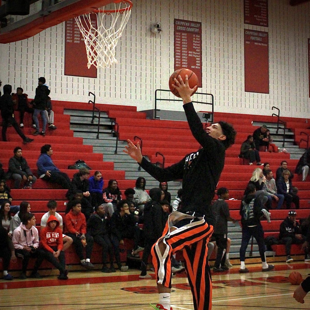 Photo of the Day #58!
Senior Kellen Condon leaping in the air for a practice shot before the game against Chippewa Valley.