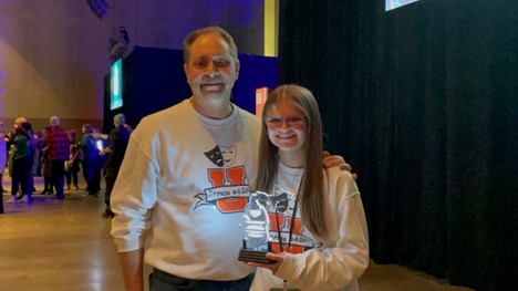 Senior Jaelyn Kaczmarczyk and teacher Joel Kaczmarczyk hold thespian award after award ceremony.