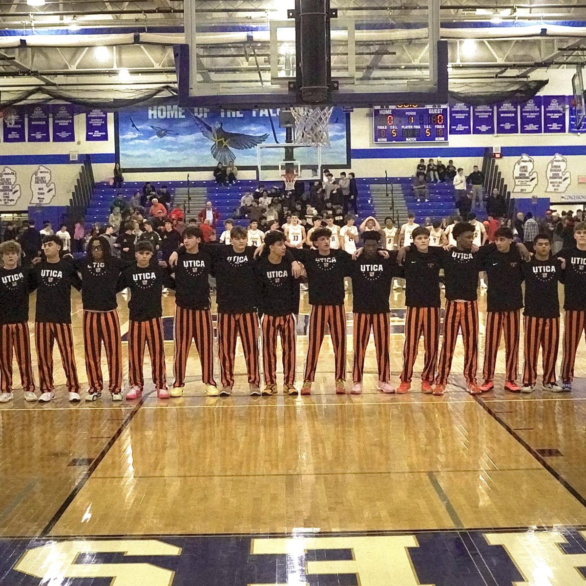 Photo of the Day #96!
The varsity boys Basketball team stand together for the National Anthem before Districts against Rochester Adams High School.