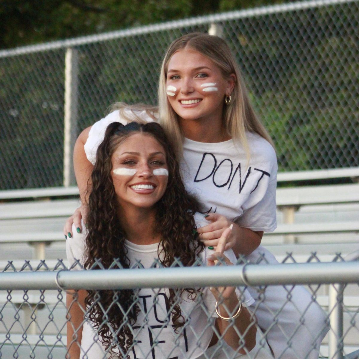 Photo of the Day #23!
On Friday, seniors Violet Smith and Kylie Condon posed for a picture at the "White Out" football game against L'Anse Creuse High School.