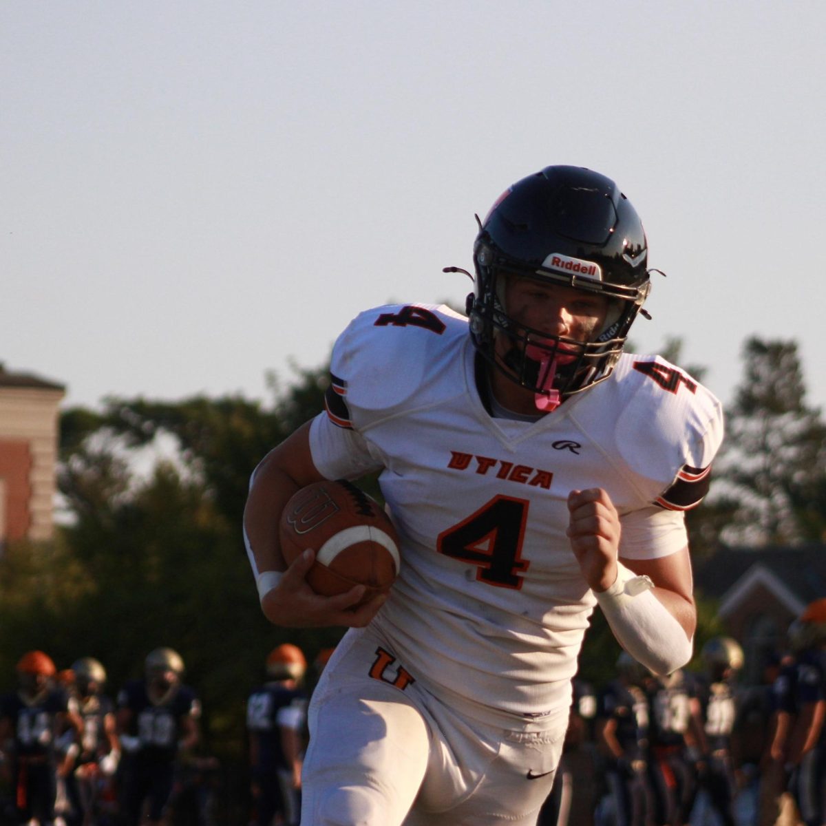 Photo of the Day #13!
Junior Drake Edward catches a pass during warmups before Friday's game against Grosse Pointe South.
