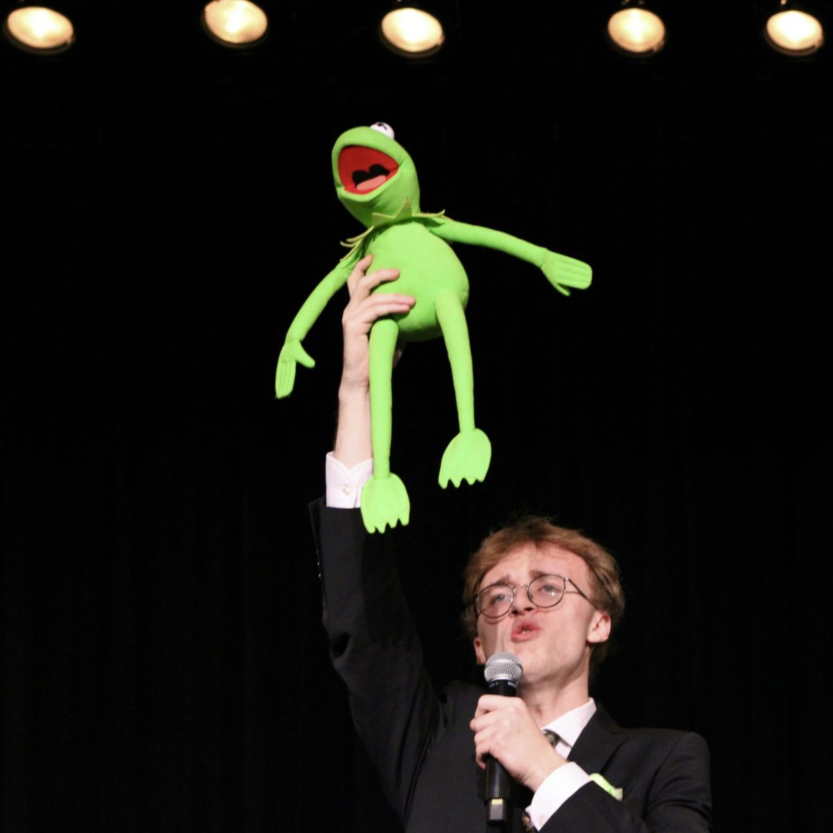 Photo of the Day #42!
Senior Jonathan McCabe doing an impression of Kermit the Frog singing, "Rainbow Connection" from the motion picture soundtrack, "The Muppets" at Utica High School for the talent show on Oct. 23.