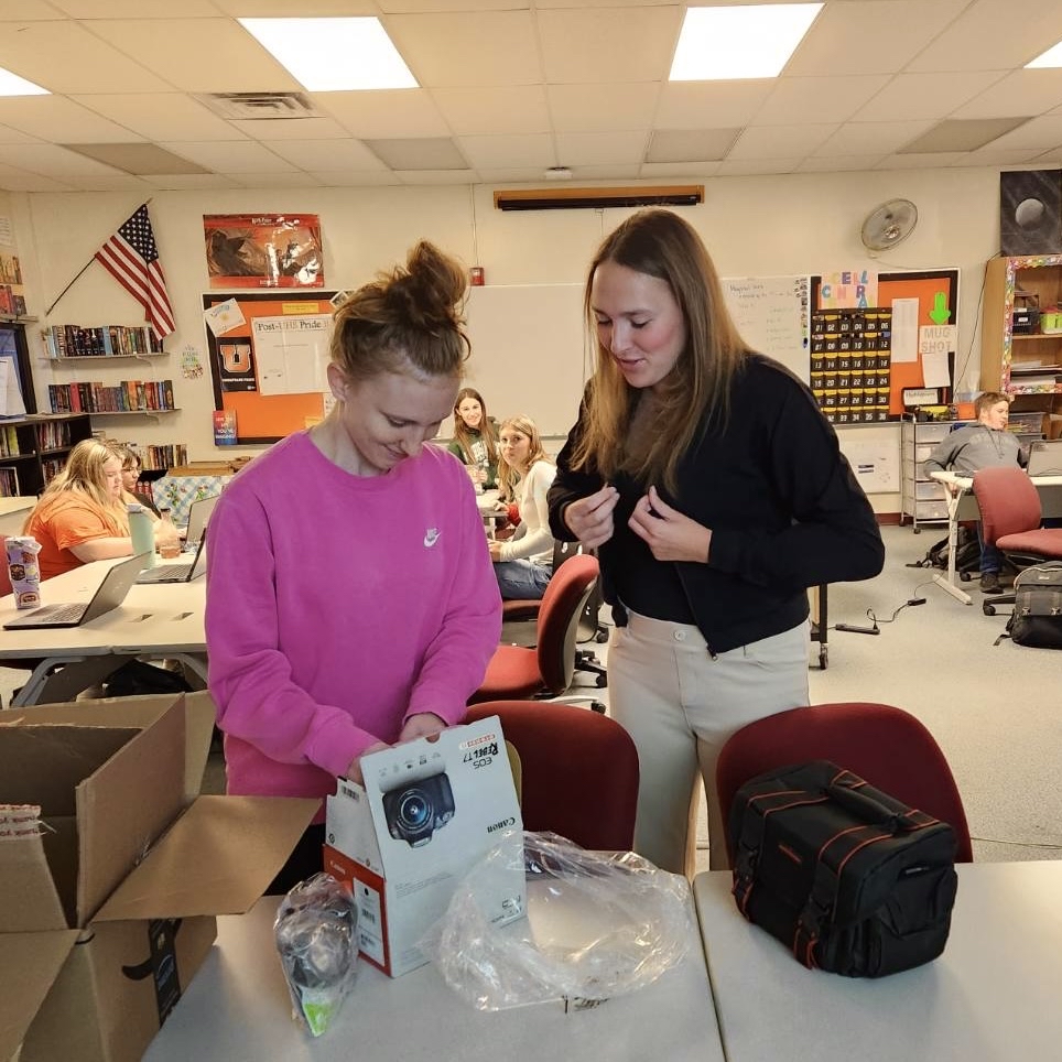 Photo of the Day #35!
Christmas morning came early for the Arrow staff on Oct. 15 as seniors Kara Boice and Anna Brown, Editors-in-Chief of the Arrow newspaper, open up their present from Mr. Youngblood containing a new camera for current and future staff to capture long lasting memories.
Thank you, Mr. Youngblood!