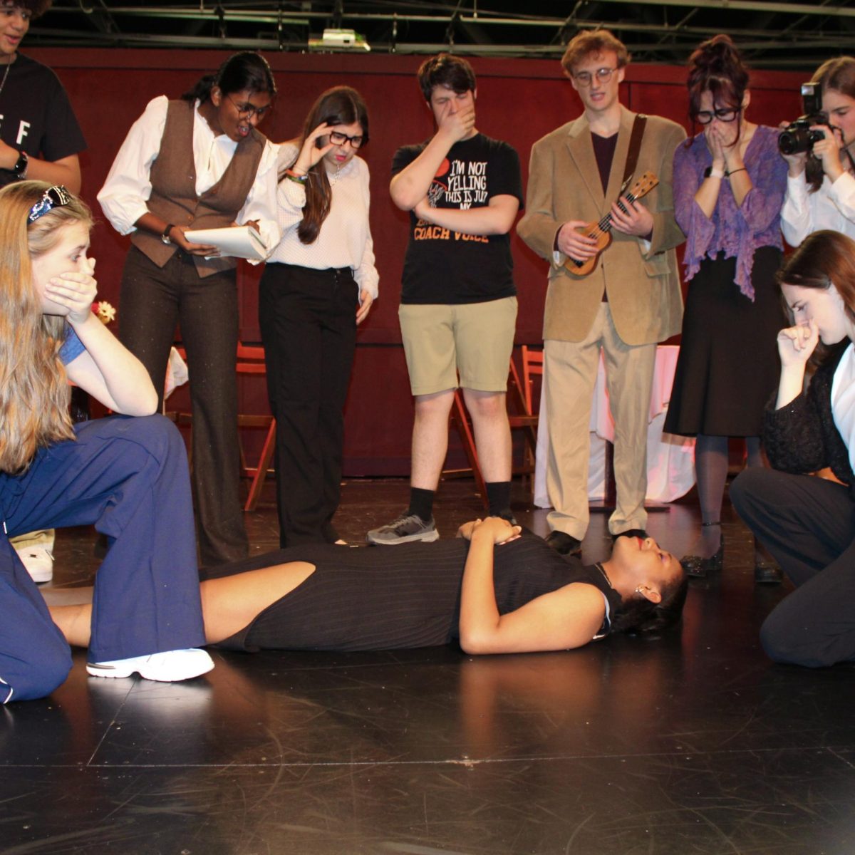 Photo of the Day #50!
Tragedy struck during the Utica theater department's media day as the portrayed a scene from this year's fall play, "Murder on the 518." This family-friendly mystery play is about passengers on a train who must solve a murder before the train arrives at its destination.