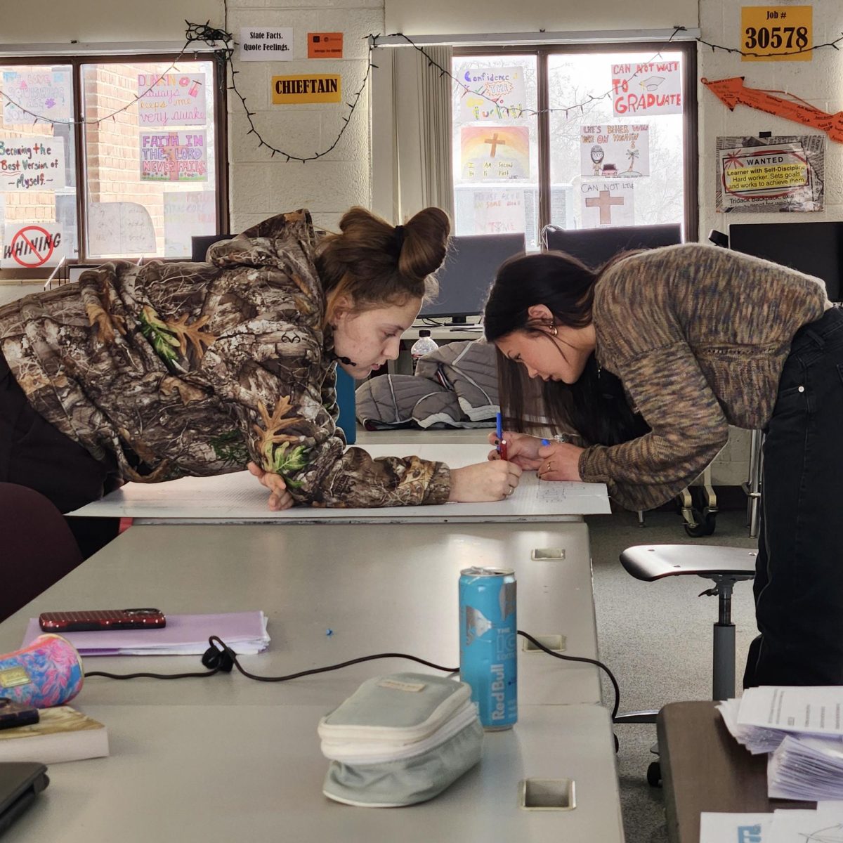 Photo of the Day #84!
Seniors Ashly Ritter and Ella Card creating an AP Literature content board for the upcoming AP Fair being hosted in the media center this Thursday, Jan. 29.