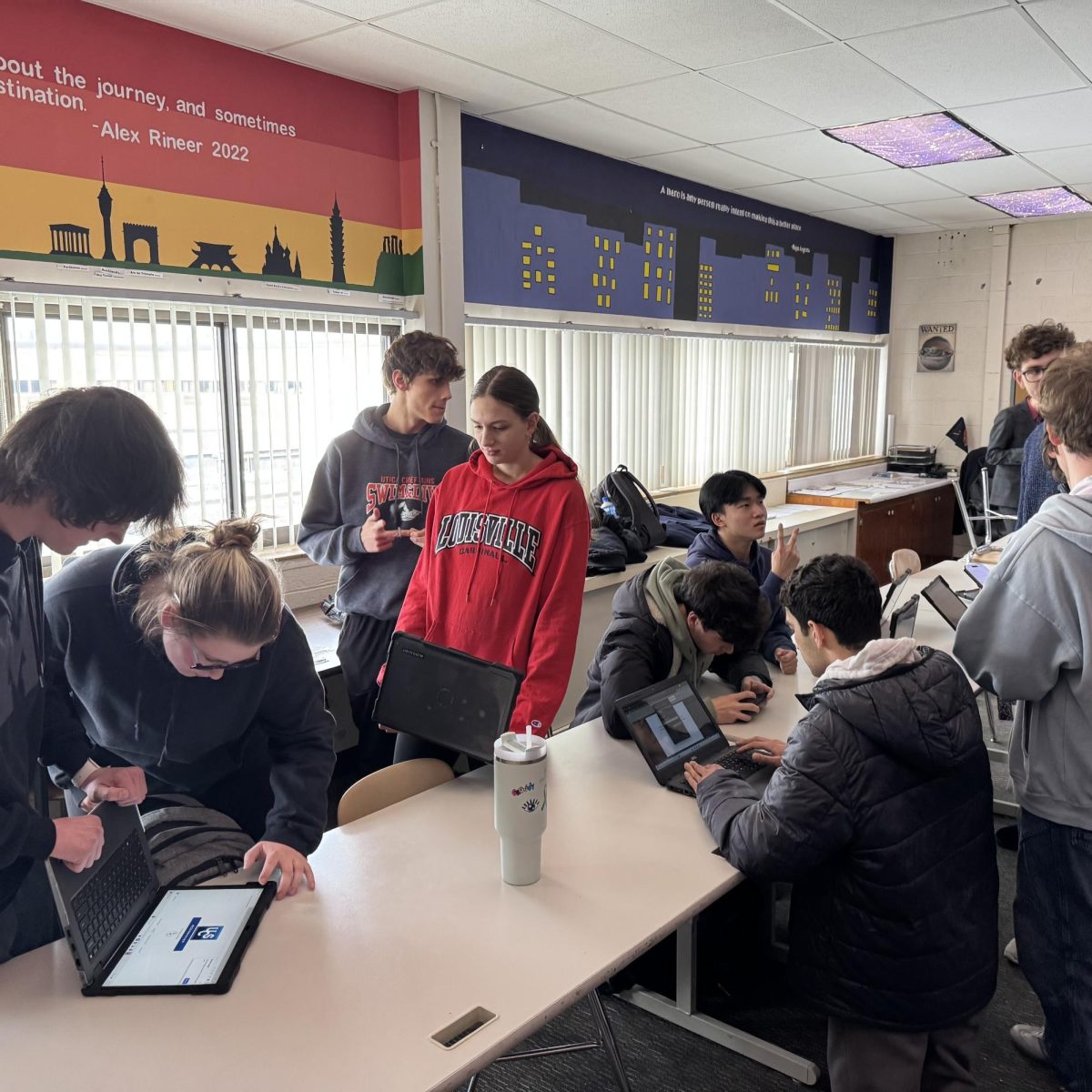 Photo of the Day #100!
Collin Syler's room was buzzing with activity from hosting a Model UN Conference to Parent-Teacher Conferences on Feb 25. Such a schedule required the Model UN club fly through their normal routine of going through their countries's position on the selected conflict; the ongoing fight with Palestine and Israel, hosting an open discussion, and resolution-making. After plentiful amounts of talking and hearing different perspectives, each country developed a resolution and presented all their ideas, causing another debate until it came to a vote to pass one resolution and reset the room for Parent-Teacher Conferences.