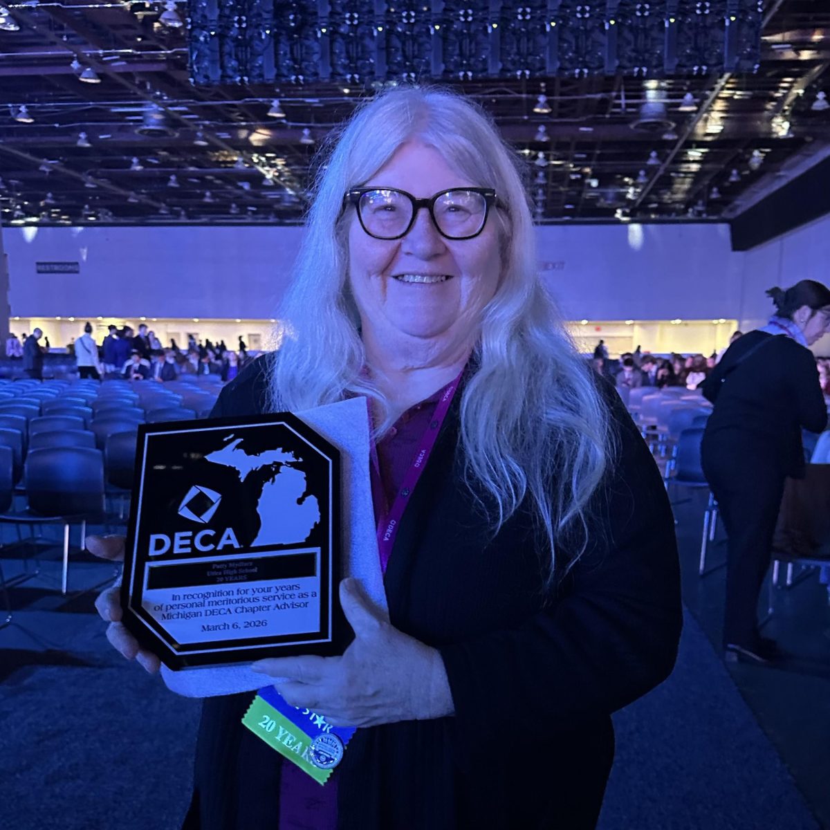 Photo of the Day #106!
After 20 years of supporting students in the DECA community, Patty Mydlarz was decorated by the Michigan DECA organization in recognition for years of personal meritorious service as a Michigan DECA Chapter Advisor at the Huntington Place on Mar. 6.