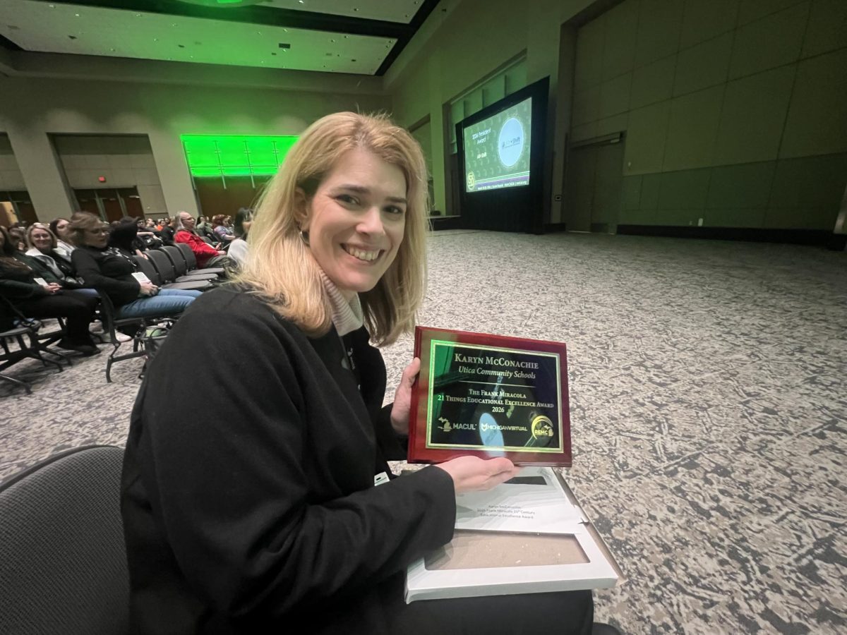 Utica High School Science Teacher Karyn McConachie posing with her Frank Miracola 21st Century Educational Excellence award representing her commitment to learning new skills and forms of technology to aid her students in the classroom in Grand Rapids, Michigan at the Michigan at the Michigan Association for Computer Users in Learning (MACUL) Conference on Mar. 18-20. 